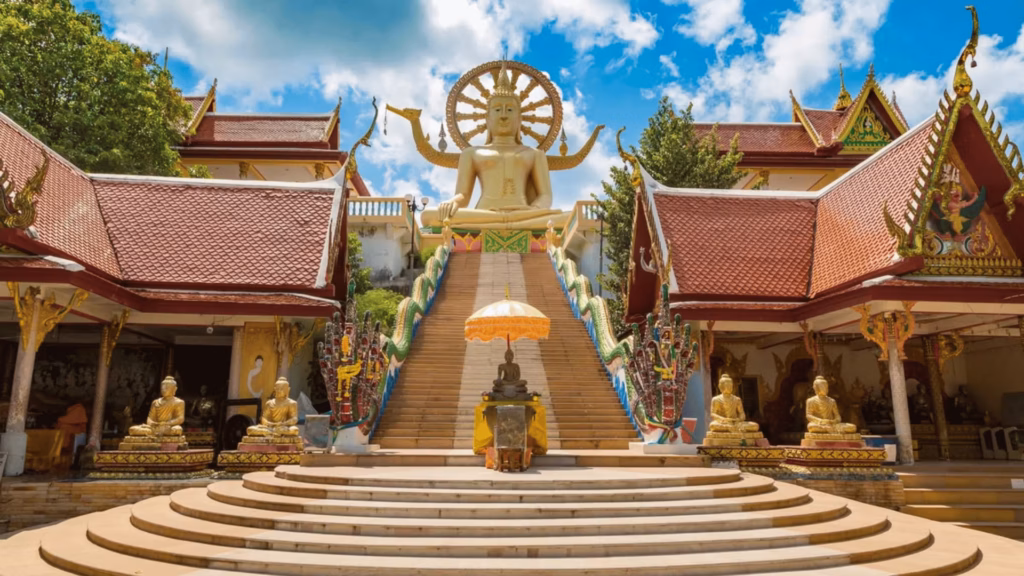 Buddhist temple courtyard with golden staircase in Koh Samui